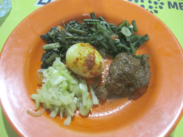 Spicy egg, Indonesian beef stew (rendang) and saute squash. You pick any dish that want from the display and then pay the total amount.