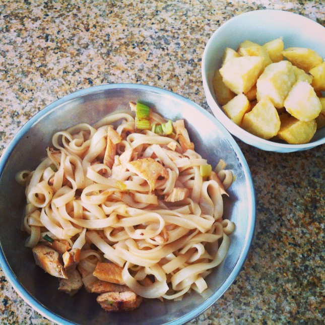 Homemade stir fry rice noodles with chicken and roasted potatoes